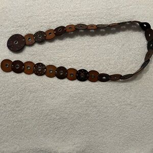 Leather medallion belt with silver accents